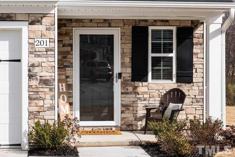 201 Rustling Way Zebulon, NC 27597 - Photo 3 of 30 a front view of a house with a window