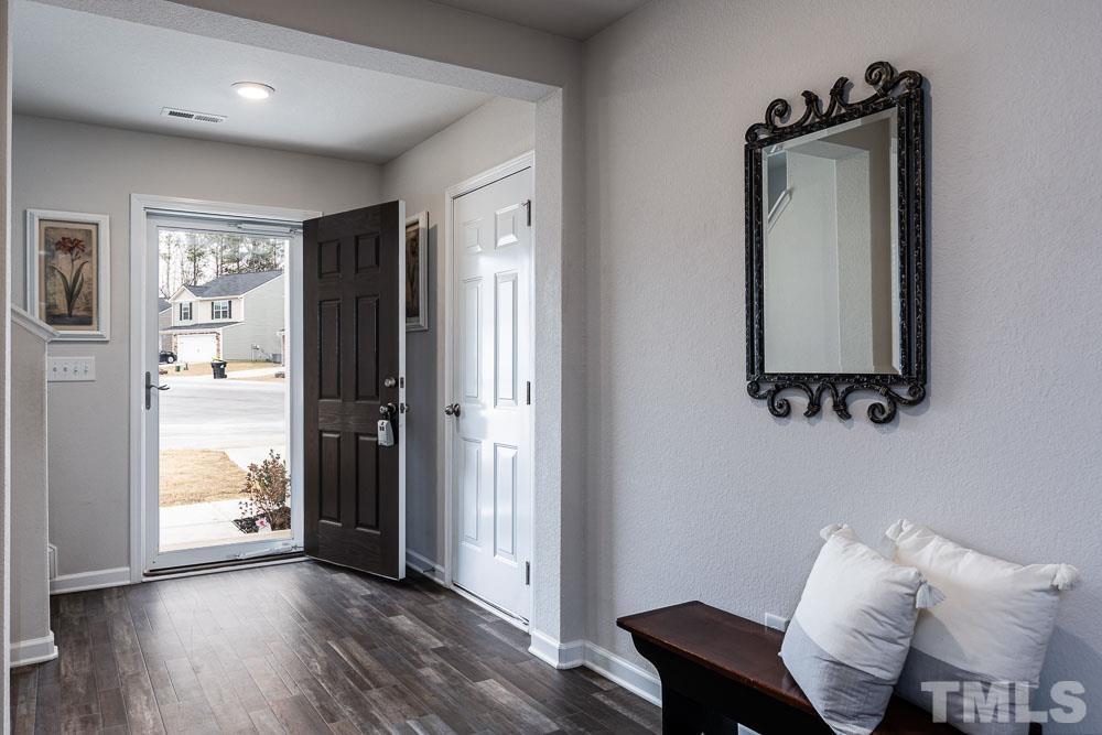 201 Rustling Way Zebulon, NC 27597 - Photo 5 of 30 a hallway with furniture and a window