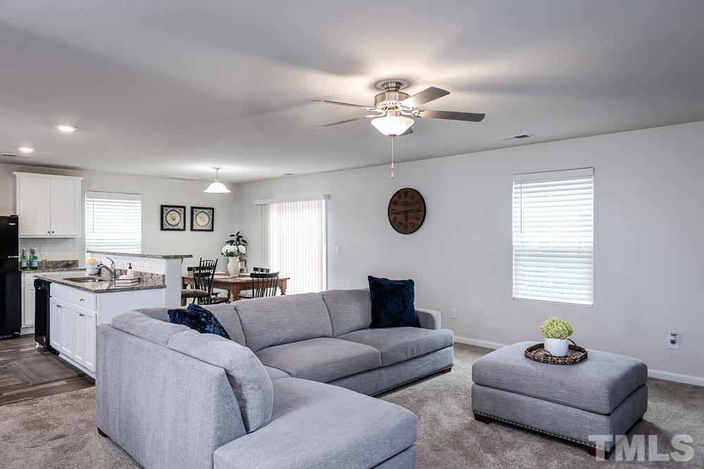 201 Rustling Way Zebulon, NC 27597 - Photo 6 of 30 a living room with furniture kitchen view and a window