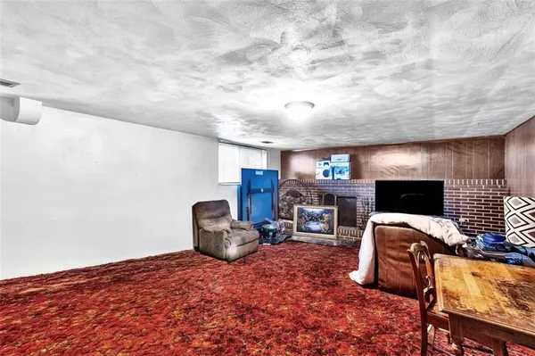a room with furniture and a flat screen tv