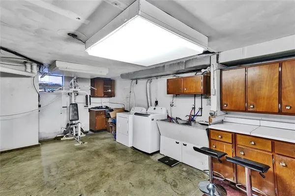 a view of a kitchen with appliances and cabinets