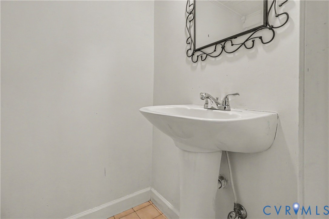 4803 Coleman Road Richmond, VA 23230 - Photo 30 of 54 Pedestal sink with chrome faucet, decorative wall