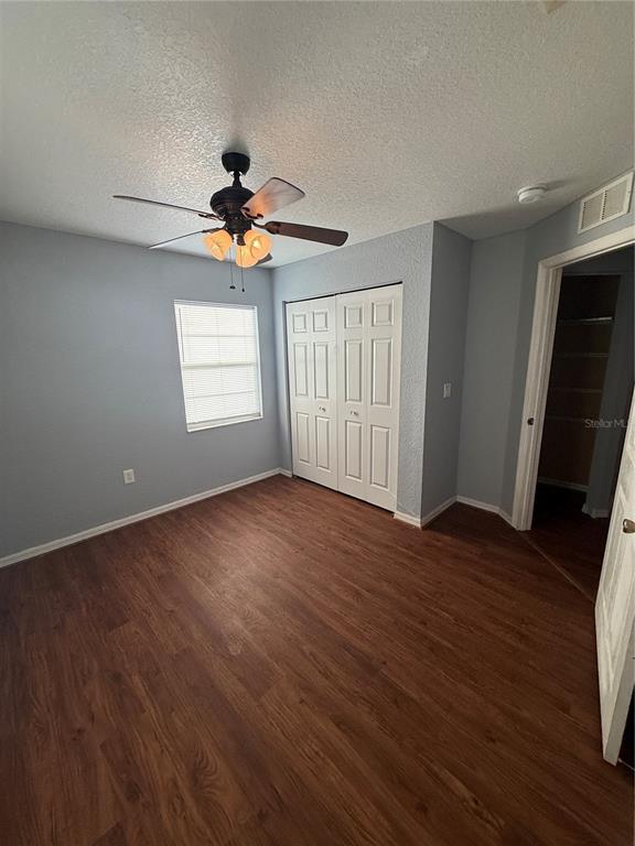 202 Owens Road Lake Wales, FL 33859 - Photo 11 of 17 a view of an empty room with a window and wooden floor