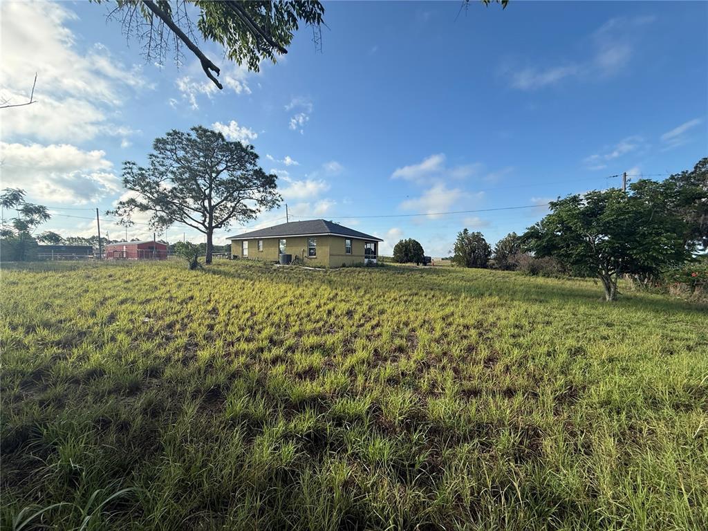202 Owens Road Lake Wales, FL 33859 - Photo 2 of 17 a view of a television with a yard