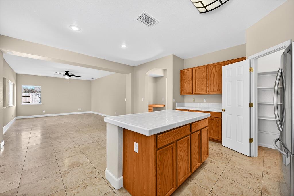 1619 7th Street Hughson, CA 95326 - Photo 14 of 61 a kitchen with stainless steel appliances granite countertop a refrigerator and a sink