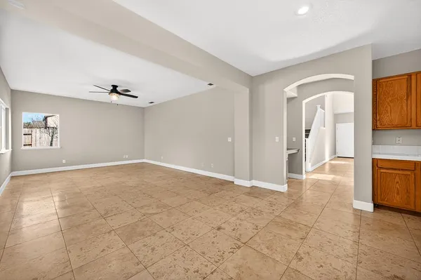 a spacious bathroom with a tub a double vanity sink and mirror
