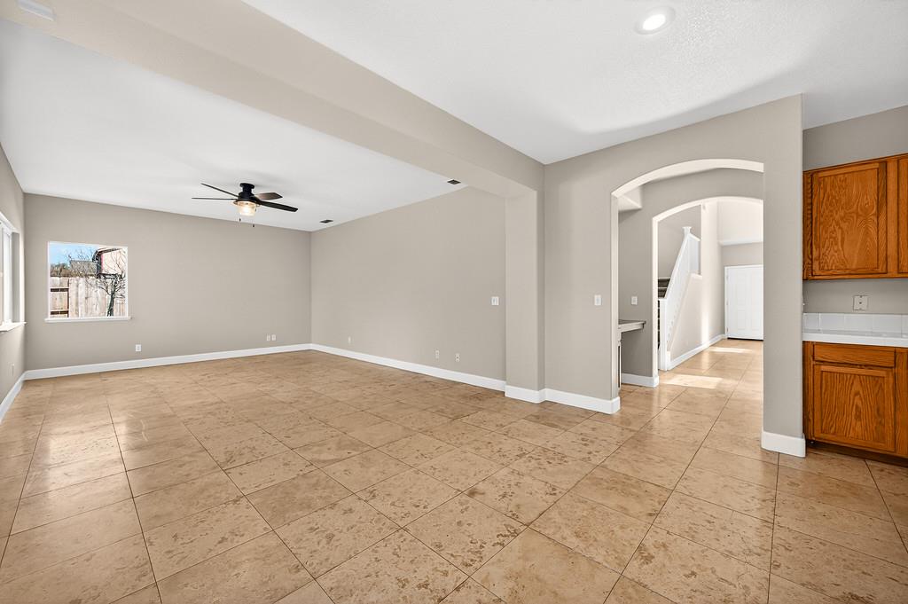 1619 7th Street Hughson, CA 95326 - Photo 17 of 61 a view of a hallway with wooden floor and a living room