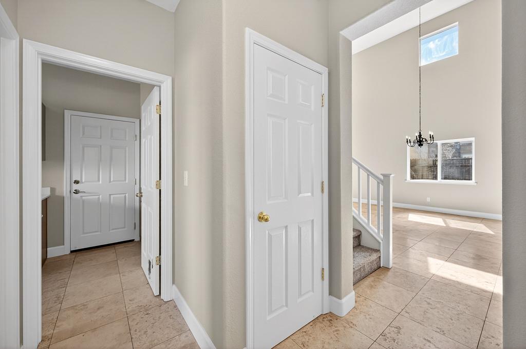1619 7th Street Hughson, CA 95326 - Photo 23 of 61 a view of a hallway with a livingroom and a bathroom