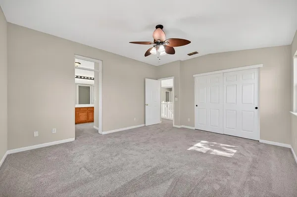 a utility room with cabinets washer and dryer