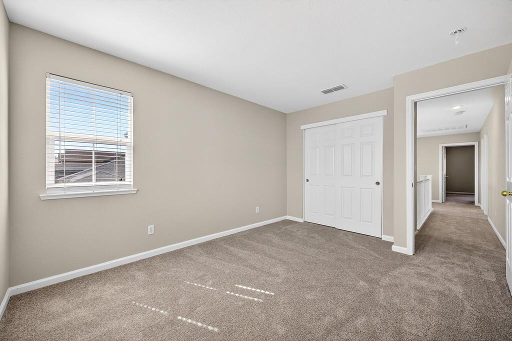 1619 7th Street Hughson, CA 95326 - Photo 34 of 61 a view of an empty room with closet and a window