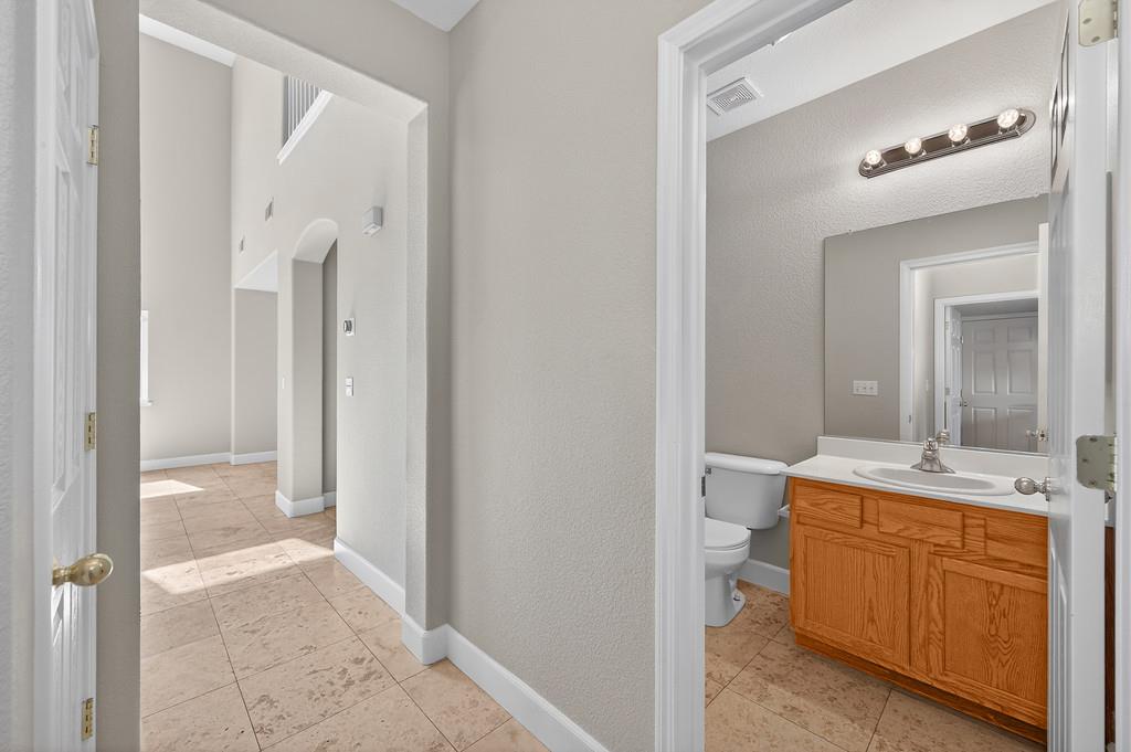1619 7th Street Hughson, CA 95326 - Photo 43 of 61 a bathroom with a sink and a mirror