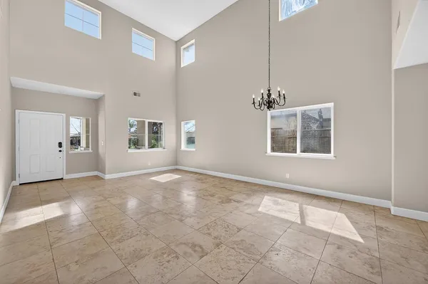 a kitchen with stainless steel appliances granite countertop a stove top oven a sink dishwasher and a refrigerator
