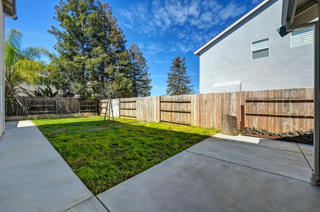 1619 7th Street Hughson, CA 95326 - Photo 54 of 61 a view of a backyard with a garden