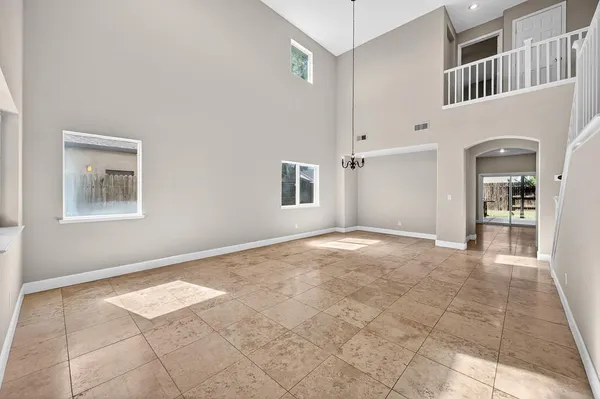 a kitchen with stainless steel appliances a stove a microwave a sink and cabinets