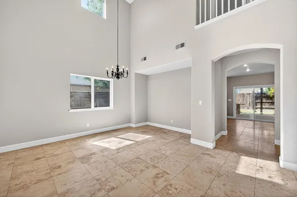 a kitchen with stainless steel appliances granite countertop a sink a stove a microwave oven with cabinets and wooden floor