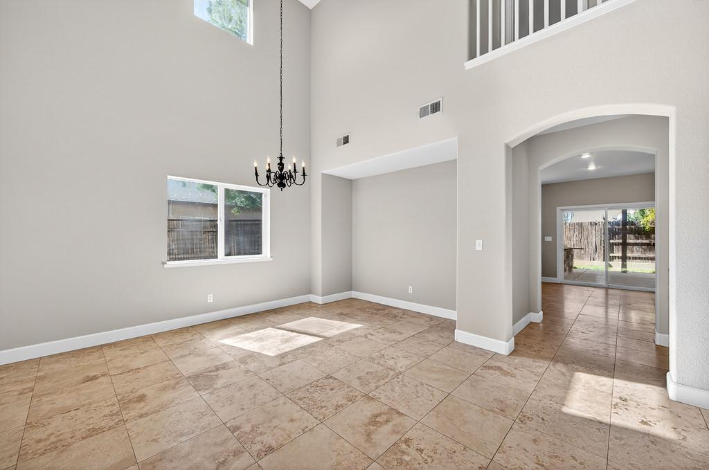 1619 7th Street Hughson, CA 95326 - Photo 7 of 61 a view of an empty room with window and wooden floor