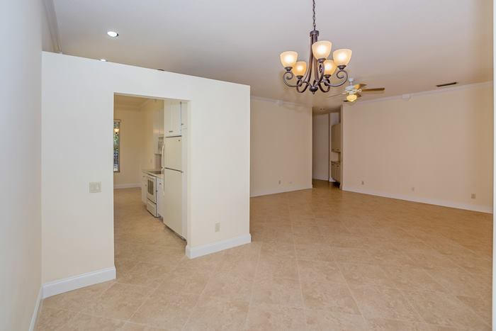 142 Hampton Circle Jupiter, FL 33458 - Photo 7 of 24 Dining to living room