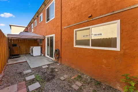a view of a brick house with a large window