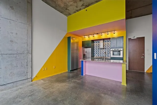 a view of a big room with windows