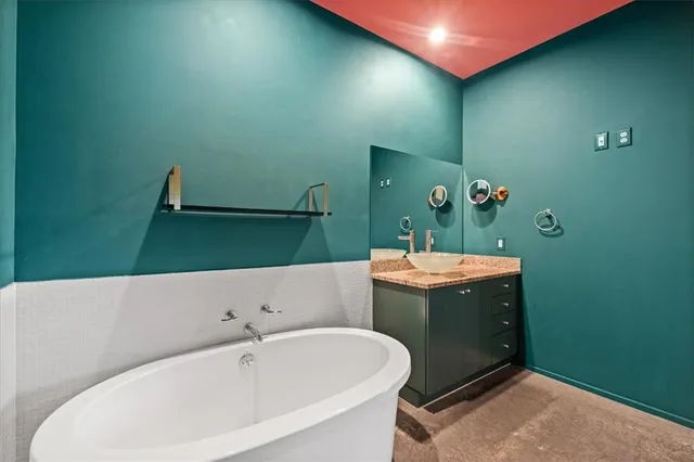 a view of a kitchen with a sink and a potted plant