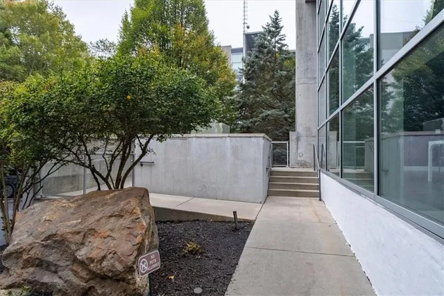 a view of a swimming pool with sitting area