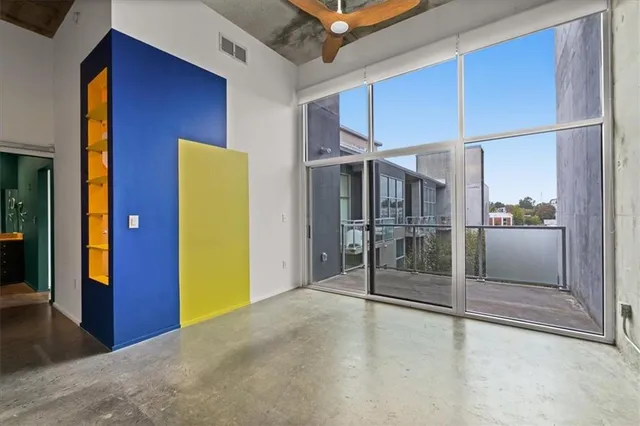 a bedroom with a bed and a potted plant