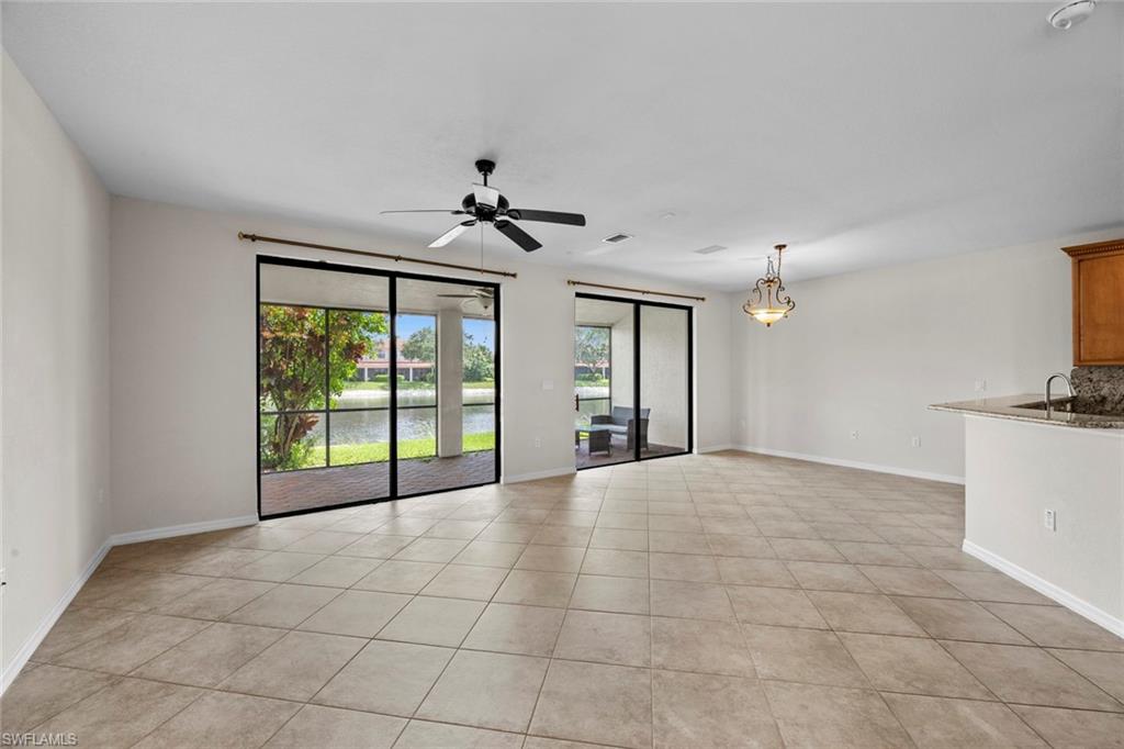 15594 Summit Pl Circle, Unit 402 Naples, FL 34119 - Photo 11 of 45 a view of an empty room with a window