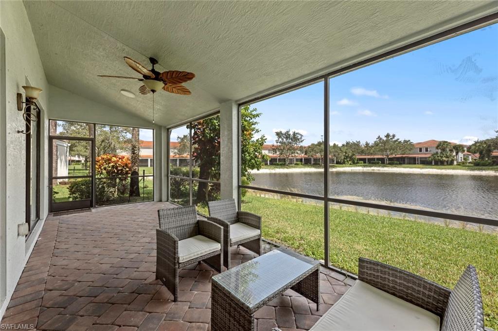 15594 Summit Pl Circle, Unit 402 Naples, FL 34119 - Photo 14 of 45 a view of a patio with swimming pool