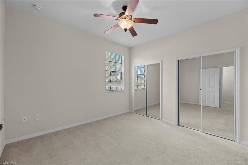 15594 Summit Pl Circle, Unit 402 Naples, FL 34119 - Photo 29 of 45 a view of an empty room with a window