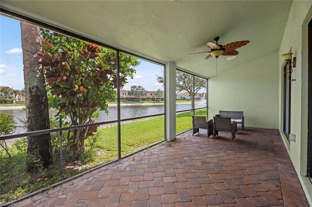 15594 Summit Pl Circle, Unit 402 Naples, FL 34119 - Photo 33 of 45 a view of a porch with chairs and backyard