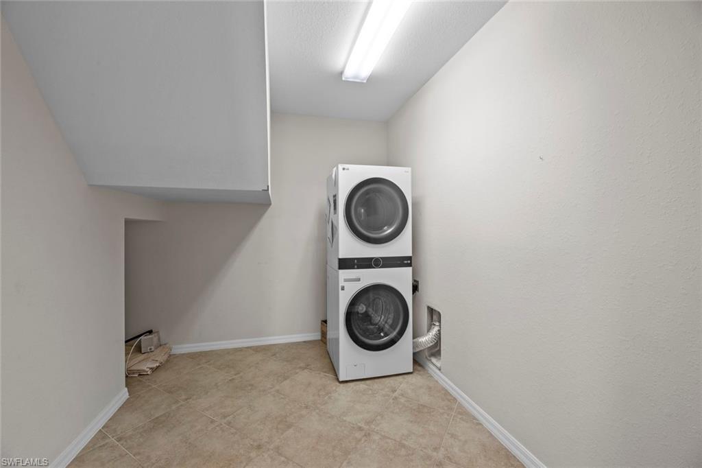 15594 Summit Pl Circle, Unit 402 Naples, FL 34119 - Photo 38 of 45 a view of space with washer and dryer