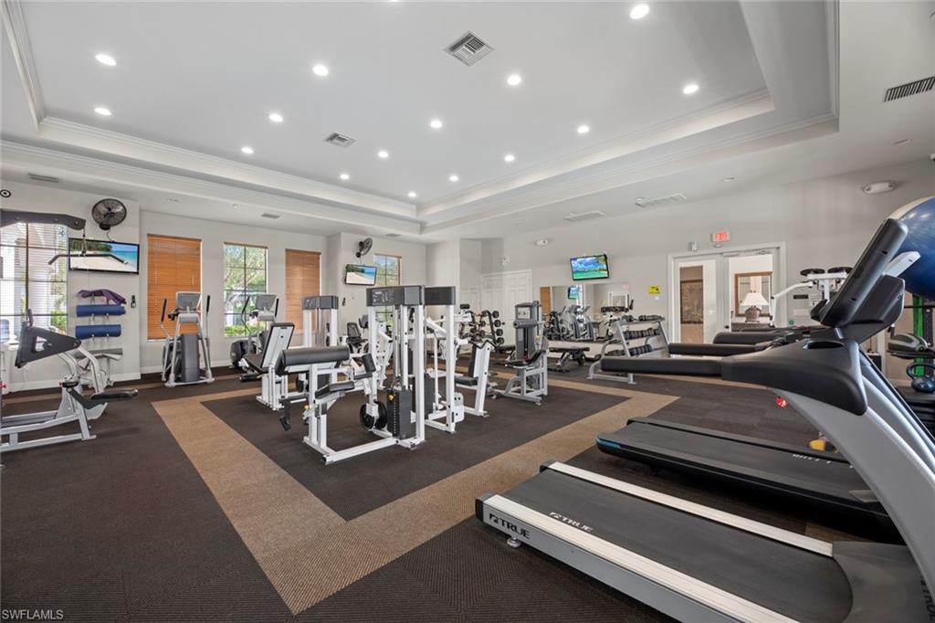 15594 Summit Pl Circle, Unit 402 Naples, FL 34119 - Photo 41 of 45 a view of a room with gym equipment