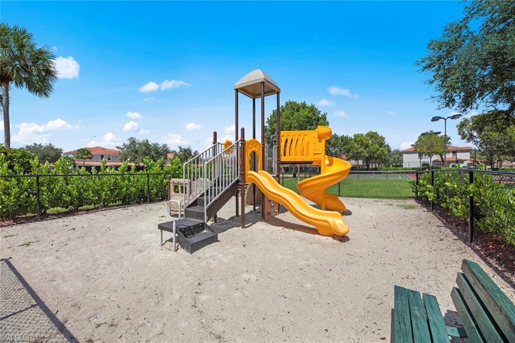 15594 Summit Pl Circle, Unit 402 Naples, FL 34119 - Photo 42 of 45 a view of a park with a slide