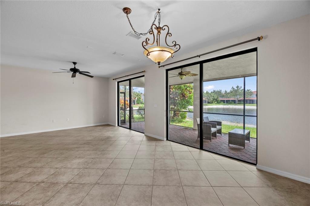 15594 Summit Pl Circle, Unit 402 Naples, FL 34119 - Photo 6 of 45 a view of an entryway with a chandelier
