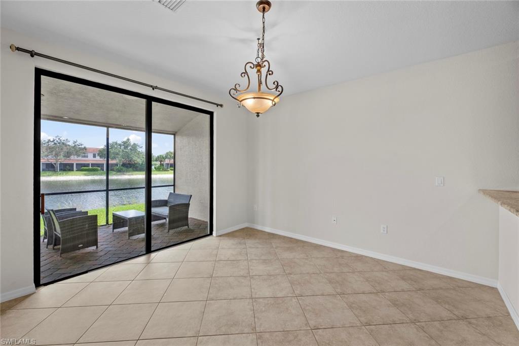 15594 Summit Pl Circle, Unit 402 Naples, FL 34119 - Photo 8 of 45 a view of an empty room with a window