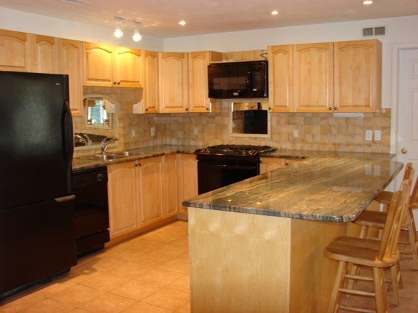 37 Kruse Road Hubbardston, MA 01452 - Photo 3 of 29 a kitchen with a sink a stove top oven and refrigerator
