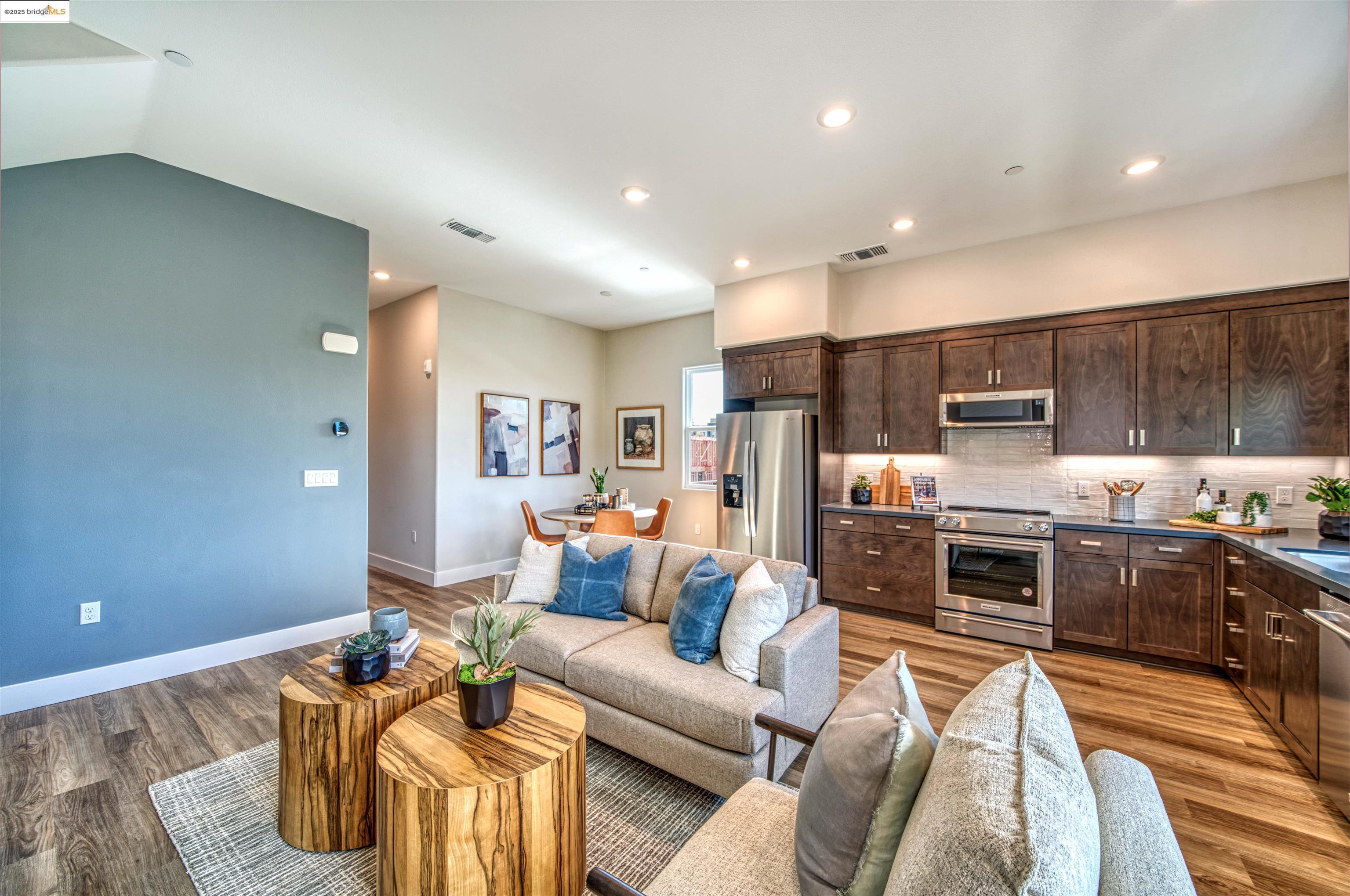 28949 Parkridge Loop, Unit 86 Hayward, CA 94544 - Photo 3 of 15 a living room with stainless steel appliances furniture stove and kitchen view