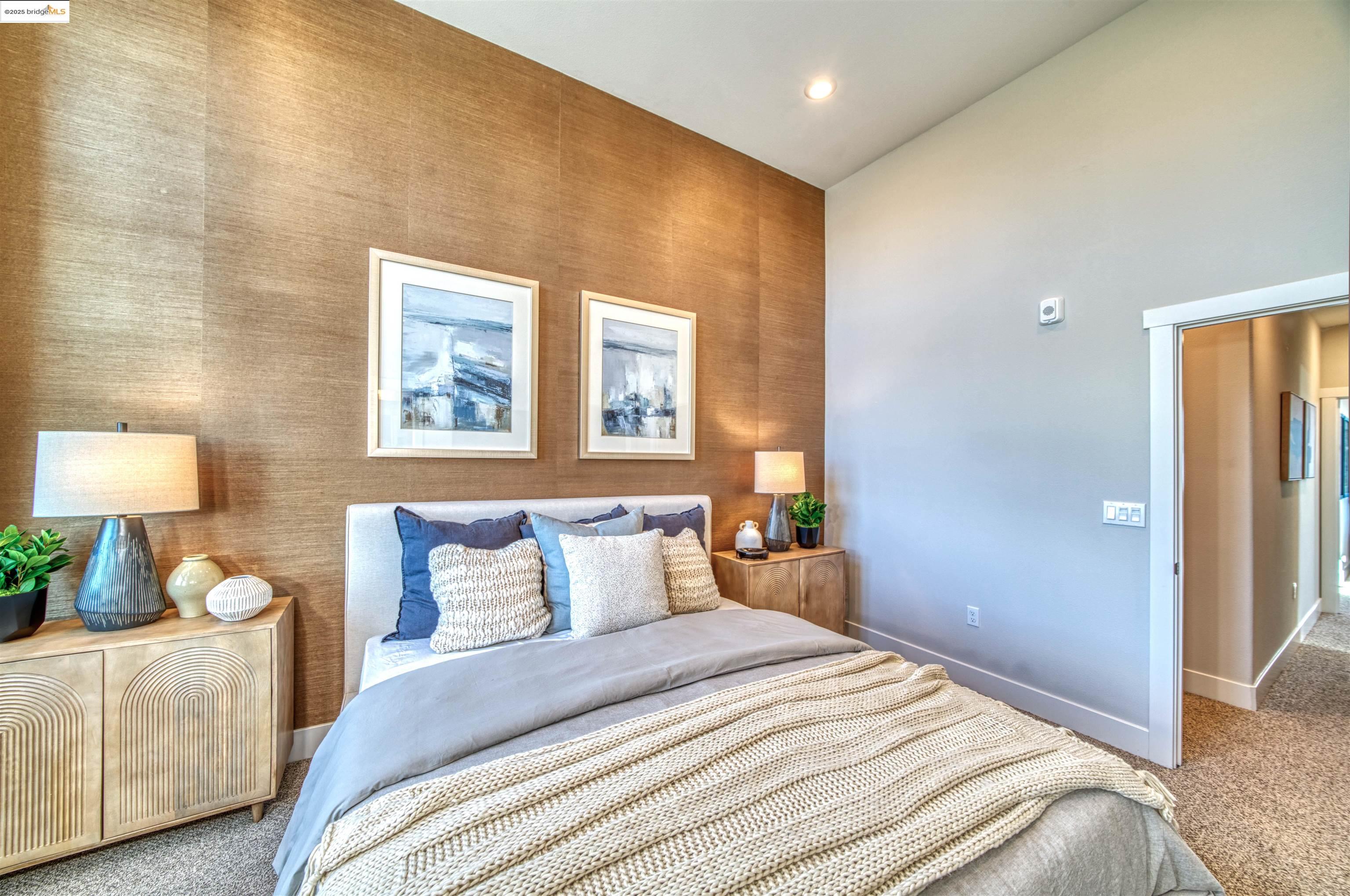 28949 Parkridge Loop, Unit 86 Hayward, CA 94544 - Photo 8 of 15 a bedroom with a bed and a lamp