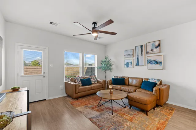 a living room with furniture and a large window