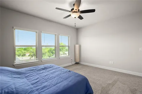 a bedroom with a bed and window