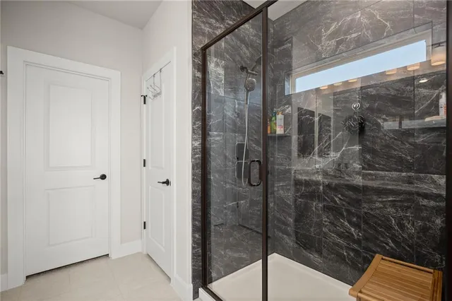 a bathroom with a glass shower door