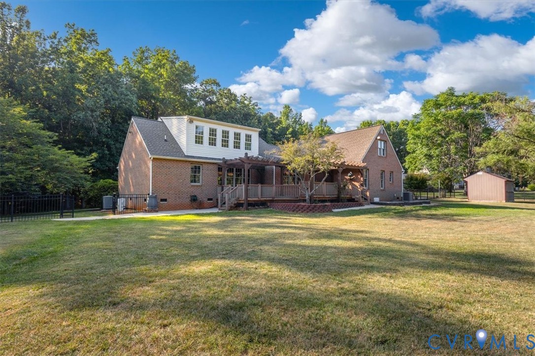 1437 Palmore Road Powhatan, VA 23139 - Photo 52 of 60 Expansive lawn bordering a brick house with a mult