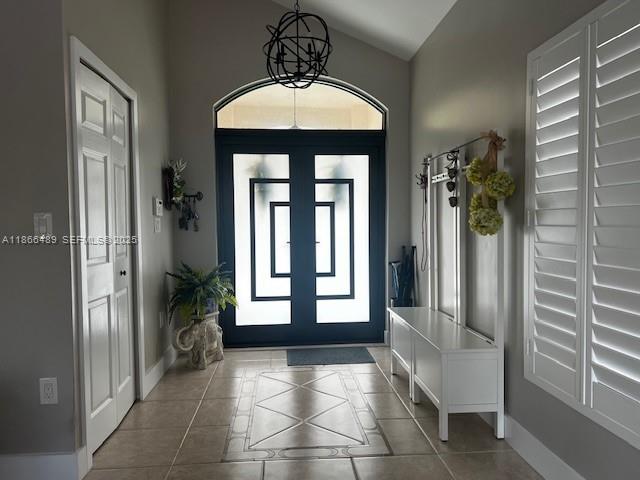 16131 Southwest 79th Terrace Miami, FL 33193 - Photo 2 of 32 a view of a hallway with windows and chandelier