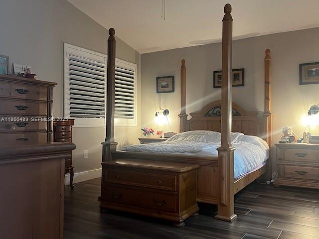16131 Southwest 79th Terrace Miami, FL 33193 - Photo 23 of 32 a bedroom with a bed and a table