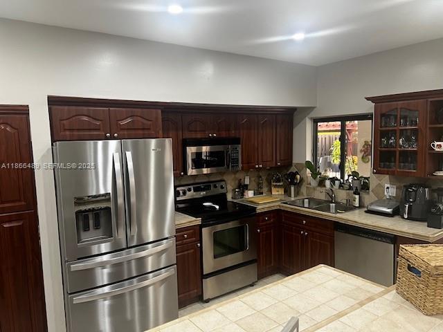 16131 Southwest 79th Terrace Miami, FL 33193 - Photo 10 of 32 a kitchen with a sink stainless steel appliances and cabinets