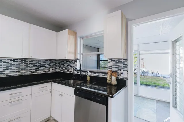 a kitchen with a sink and cabinets