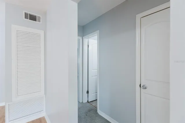 a bedroom with bed and a window