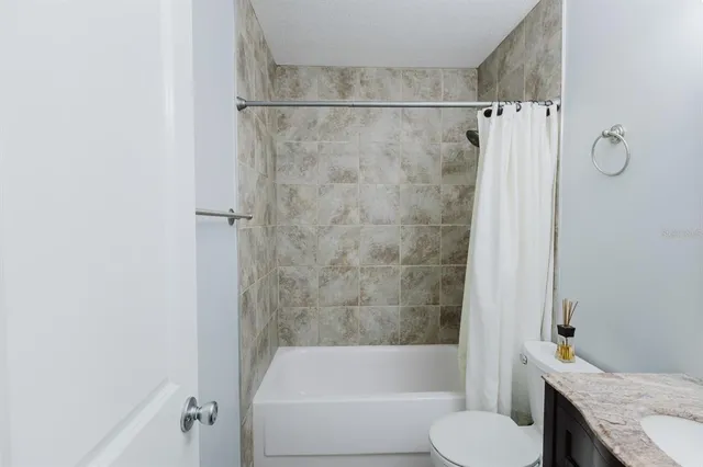 a bathroom with a sink vanity and a mirror