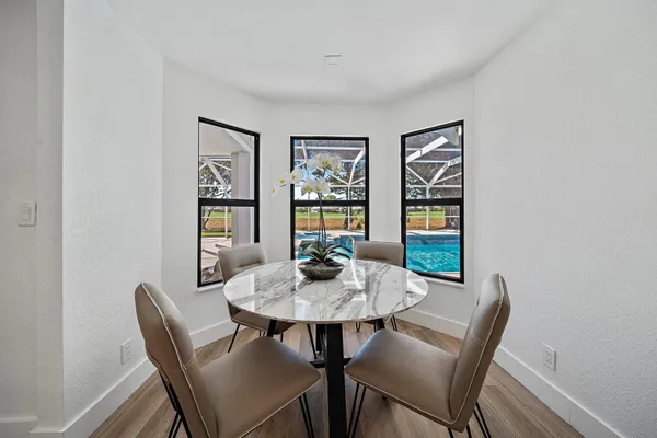 a dining room with furniture and window