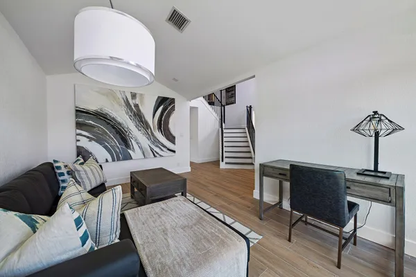 a view of a livingroom with furniture and a couch